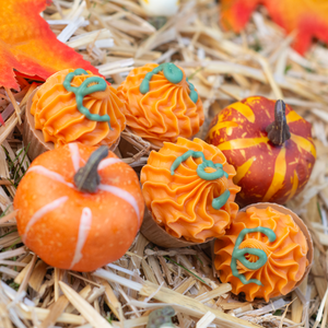 pumpkin treat cups in a hay stack